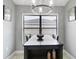 Cozy dining area with a chandelier, window with blinds, and view of the outdoors at 12729 Flatwood Creek Dr, Gibsonton, FL 33534