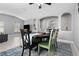 Dining room featuring an arched doorway and view of the living room at 12729 Flatwood Creek Dr, Gibsonton, FL 33534