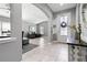 Welcoming foyer featuring tile flooring, an arched entryway, and ample natural light at 12729 Flatwood Creek Dr, Gibsonton, FL 33534