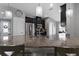 Kitchen with dark cabinetry, stainless steel appliances, and granite countertops on the island at 12729 Flatwood Creek Dr, Gibsonton, FL 33534