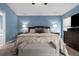 Tranquil main bedroom features an inviting bed, soft lighting, and a neutral color palette at 12729 Flatwood Creek Dr, Gibsonton, FL 33534