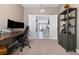 Bright office with white double doors leading to the living area and kitchen at 12729 Flatwood Creek Dr, Gibsonton, FL 33534