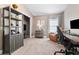 Cozy office space featuring a bookshelf, filing cabinet, and a comfortable leather chair at 12729 Flatwood Creek Dr, Gibsonton, FL 33534
