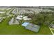 Expansive aerial view showcasing community amenities: pool, tennis, basketball courts, and clubhouse at 13016 Boggy Creek Dr, Riverview, FL 33579