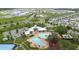 Overhead view featuring neighborhood pool, clubhouse, and surrounding homes and community at 13016 Boggy Creek Dr, Riverview, FL 33579