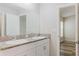 Bathroom features double sinks and a view to the bedroom at 13016 Boggy Creek Dr, Riverview, FL 33579
