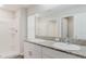 Bathroom features double sinks with granite countertop and an easy-access shower at 13016 Boggy Creek Dr, Riverview, FL 33579