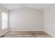 Spacious room featuring vinyl flooring, natural light, and vaulted ceiling at 13016 Boggy Creek Dr, Riverview, FL 33579