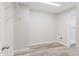 Walk-in closet with wooden style vinyl floors at 13016 Boggy Creek Dr, Riverview, FL 33579