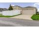 Street view of attached garage with driveway and fenced in yard, showcasing secure parking at 13016 Boggy Creek Dr, Riverview, FL 33579