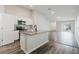 Modern kitchen featuring stainless steel appliances, granite countertops, and an island with a sink at 13016 Boggy Creek Dr, Riverview, FL 33579