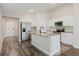 Modern kitchen featuring stainless steel appliances, granite countertops, and an island with sink at 13016 Boggy Creek Dr, Riverview, FL 33579