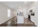 Bright kitchen featuring an island with granite countertops and stainless steel appliances with white cabinetry at 13016 Boggy Creek Dr, Riverview, FL 33579