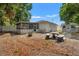 Backyard featuring a stone picnic table, outdoor shed, and screened in back porch at 1419 30Th N Ave, St Petersburg, FL 33704