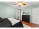Relaxing bedroom with wood floors, neutral walls, and dark furniture at 1419 30Th N Ave, St Petersburg, FL 33704