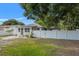 Charming home with a well maintained lawn and white picket fence at 1419 30Th N Ave, St Petersburg, FL 33704