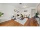 Bright living room with hardwood floors, modern furnishings, and ample natural light at 1419 30Th N Ave, St Petersburg, FL 33704