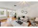 Well-lit living space with hardwood floors, an open layout, and views of the exterior at 1419 30Th N Ave, St Petersburg, FL 33704
