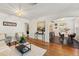 Stylish living room with hardwood floors, modern decor, and an open layout to the dining area at 1419 30Th N Ave, St Petersburg, FL 33704