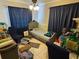 Cozy bedroom with tiled floors, blue curtains, and a twin-sized bed at 16134 Ravendale Dr, Tampa, FL 33618