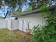 Exterior side of home, showing privacy fence and side yard at 16134 Ravendale Dr, Tampa, FL 33618