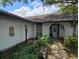 The home has a charming front entrance with detailed stone walkway and decorative plants at 16134 Ravendale Dr, Tampa, FL 33618