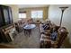 Spacious living room featuring comfortable sofas, vintage decor, and natural light at 16134 Ravendale Dr, Tampa, FL 33618