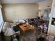 Spacious living room featuring comfortable sofas and natural light from large windows at 16134 Ravendale Dr, Tampa, FL 33618