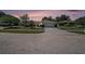 Inviting single-story home with a spacious driveway, a two-car garage, and a meticulously maintained front yard at 162 Lagoon Way, Palm Harbor, FL 34684