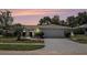 Charming single-story home featuring a well-manicured lawn, a two-car garage, and a beautifully landscaped yard at 162 Lagoon Way, Palm Harbor, FL 34684