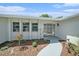 Inviting front entrance with decorative landscaping, a stylish door, and a smooth walkway at 162 Lagoon Way, Palm Harbor, FL 34684