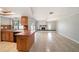 Open concept living room and kitchen with tile floors, a fireplace, and sliding glass doors at 162 Lagoon Way, Palm Harbor, FL 34684