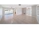 Expansive living area with tile floors, neutral walls, and natural light at 162 Lagoon Way, Palm Harbor, FL 34684