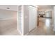 Spacious living room with tile flooring, neutral paint, and built in shelves at 162 Lagoon Way, Palm Harbor, FL 34684
