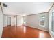 Large bedroom with hardwood floors, ceiling fan, and generous natural light from sizable windows at 162 Lagoon Way, Palm Harbor, FL 34684