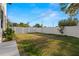 Fenced backyard with some grass and minimal vegetation at 1625 55Th S St, Gulfport, FL 33707