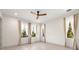 Bright bedroom featuring hardwood floors, neutral walls, and a ceiling fan at 1625 55Th S St, Gulfport, FL 33707