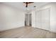 Bright and modern bedroom with light wood floors and an en suite bathroom at 1625 55Th S St, Gulfport, FL 33707