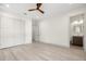 Bright bedroom featuring hardwood floors, neutral walls, and ensuite bathroom at 1625 55Th S St, Gulfport, FL 33707