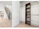 Walk-in closet adjacent to the stairs for optimal storage and organization at 1625 55Th S St, Gulfport, FL 33707