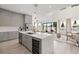 Open-concept kitchen featuring a center island with a wine cooler, and seamlessly flows into the living area at 1625 55Th S St, Gulfport, FL 33707