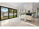 Bright living room features large windows, light wood floors, and a modern fireplace at 1625 55Th S St, Gulfport, FL 33707