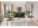 Living room featuring a stone fireplace, high ceilings and lots of natural light at 1625 55Th S St, Gulfport, FL 33707