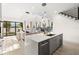An open-concept kitchen and living space with modern finishes and access to the outdoors through sliding glass doors at 1625 55Th S St, Gulfport, FL 33707