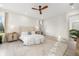 Airy main bedroom with light wood floors, a neutral color scheme, and a large bed at 1625 55Th S St, Gulfport, FL 33707