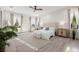 Spacious main bedroom with a ceiling fan, neutral tones, and an abundance of natural light at 1625 55Th S St, Gulfport, FL 33707