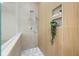 Modern tiled shower with rainfall shower head and built-in shelving, providing a spa-like experience at 1625 55Th S St, Gulfport, FL 33707