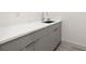 Modern bathroom sink with gray cabinets, clean lines, and bright white countertops at 1625 55Th S St, Gulfport, FL 33707