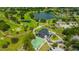 Elevated aerial view of a golf course community with scenic lakes and clubhouse at 16317 Colwood Dr, Odessa, FL 33556