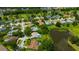Community aerial view showcasing residences, ponds and lush landscaping at 16317 Colwood Dr, Odessa, FL 33556